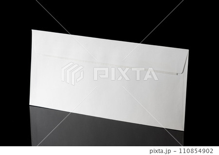White craft envelope isolated on black background 110854902