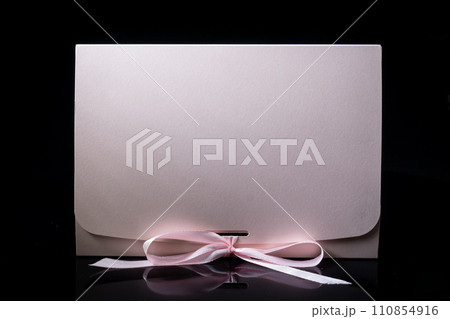 Man gift concept. gift box with luxury bow on dark background. Horizontal with copy space. 110854916