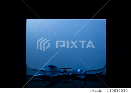 Man gift concept. gift box with luxury bow on dark background. Horizontal with copy space. 110855056