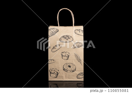 Recyclable craft paper bag for purchases, gifts and takeaway food mock up on black background. Environmentally friendly than single-use plastic bags Recyclable craft paper bag for purchases, gifts and takeaway food mock up on black background. Environmentally friendly than single-use plastic bags 110855081