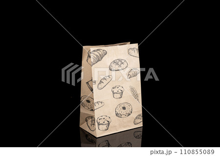 Recyclable craft paper bag for purchases, gifts and takeaway food mock up on black background. Environmentally friendly than single-use plastic bags Recyclable craft paper bag for purchases, gifts and takeaway food mock up on black background. Environmentally friendly than single-use plastic bags 110855089