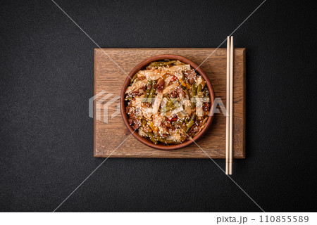 Delicious Asian dish udon with hot peppers, green beans, spices and herbs 110855589