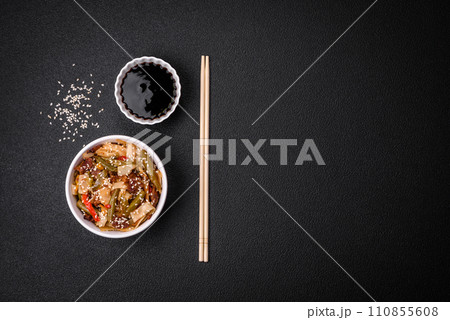 Delicious Asian dish udon with hot peppers, green beans, spices and herbs 110855608