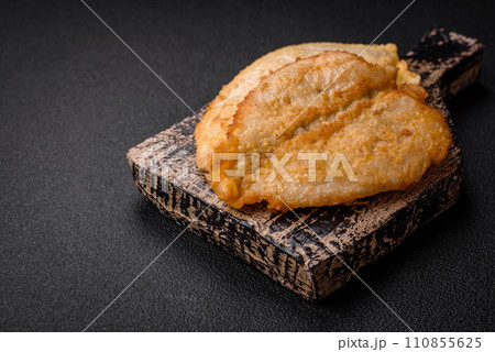 Delicious battered chicken breast chops with salt, spices and herbs 110855625