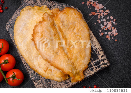 Delicious battered chicken breast chops with salt, spices and herbs 110855631