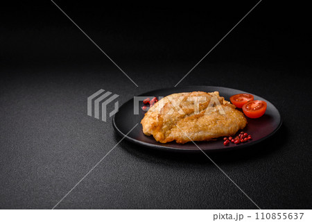 Delicious battered chicken breast chops with salt, spices and herbs 110855637