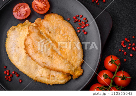 Delicious battered chicken breast chops with salt, spices and herbs 110855642