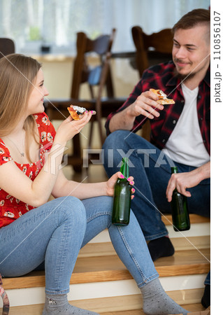 The happy couple spend time together on a date at home. 110856107