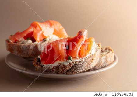Sandwich with smoked trout, cream cheese, and capers. Sandwich with smoked trout, cream cheese, and capers. 110856203