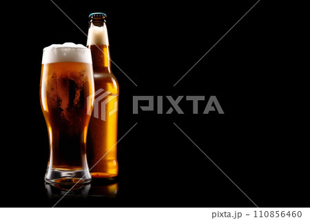 Set of Beer glasses and bottles on a black background. Mugs with drink like Ipa, Pale Ale, Pilsner, Porter or Stout 110856460