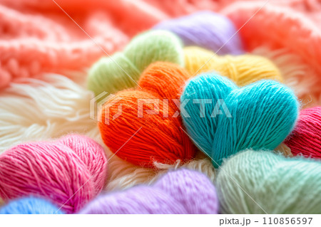 Poster or banner of colorful yarn hearts on surface on a blue background, Vibe of st. Valentine day and romantic 110856597