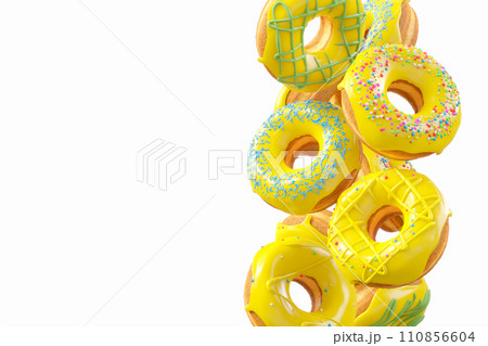 Chocolate glazed donut with sprinkles in motion falling on a white background. Chocolate glazed donut with sprinkles in motion falling on a white background. 110856604