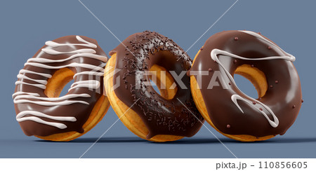 A pile of chocolate glazed donuts with sprinkles in motion falling on a grey A pile of chocolate glazed donuts with sprinkles in motion falling on a grey 110856605