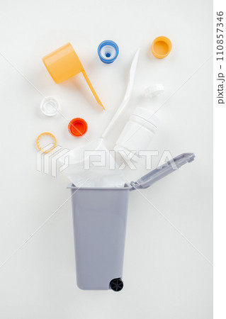 Plastic in garbage bin on white background Plastic in garbage bin on white background 110857346