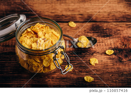 Jar of corn flakes for breakfast 110857416
