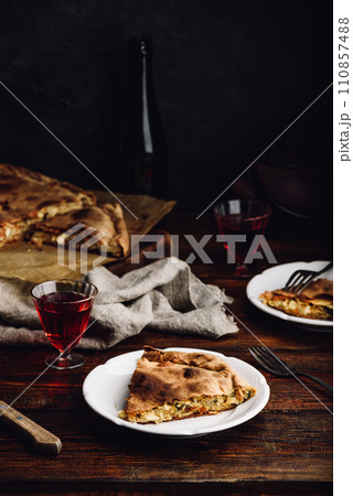 Slice of cabbage pie on white plate Slice of cabbage pie on white plate 110857488