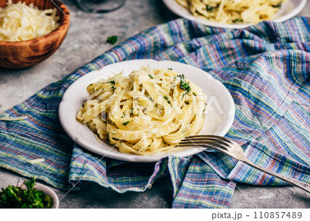 Portions of Pasta with Alfredo Sauce Portions of Pasta with Alfredo Sauce 110857489