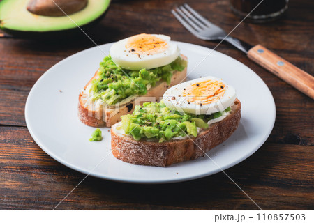 Avocado toast with cream cheese and boiled egg for breakfast Avocado toast with cream cheese and boiled egg for breakfast 110857503