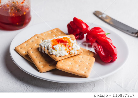 Habanero sauce with cream cheese on crackers Habanero sauce with cream cheese on crackers 110857517