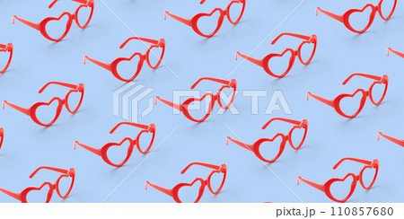 Pattern made with red heart shaped sunglasses on pastel color background Pattern made with red heart shaped sunglasses on pastel color background 110857680
