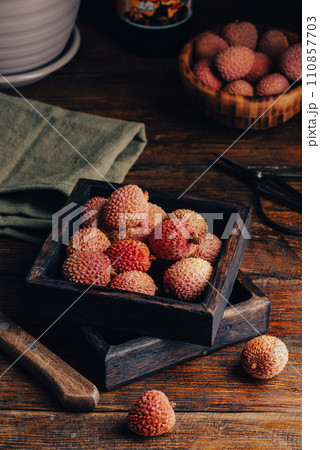 Lychees in Small Wooden Tray Lychees in Small Wooden Tray 110857703