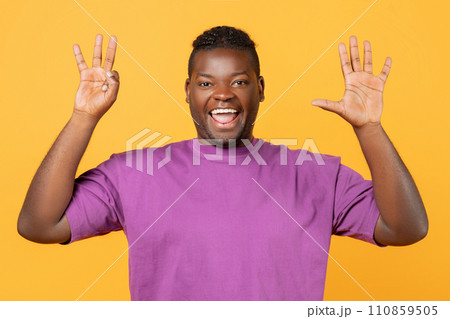 Cheerful black guy raising both hands showing number eight, studio Cheerful black guy raising both hands showing number eight, studio 110859505