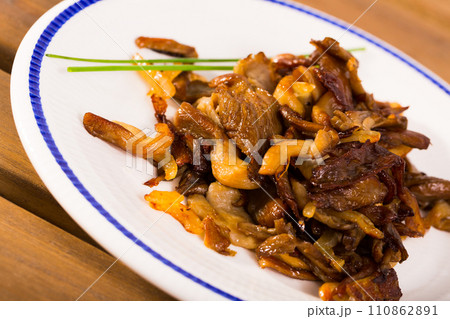 Roasted mushrooms on wooden table 110862891