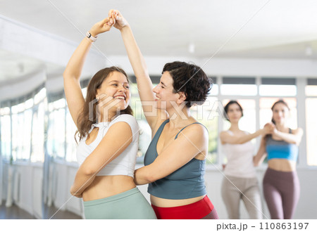 Group of women dancing pair dances in studio 110863197