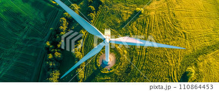 AI-generated content. Wind turbine amidst green landscape, aerial view 110864453