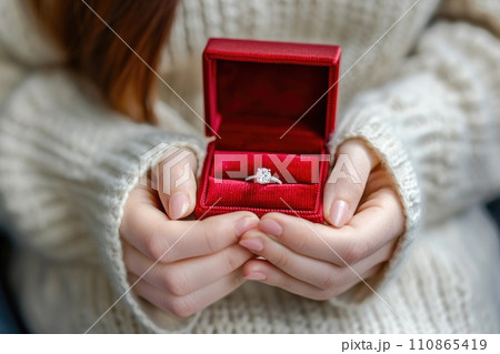 diamond ring in red box in woman hand on . ai generative 110865419