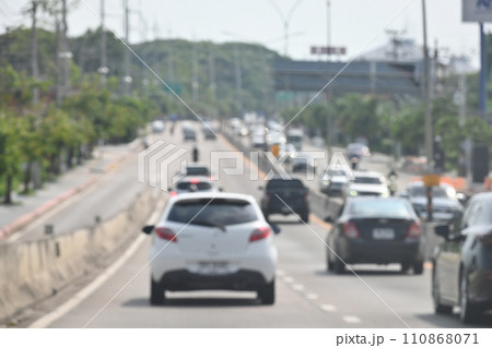 highway traffic with safety barrier on road asphalt, blurred image 110868071