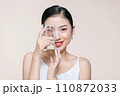 beautiful girl drinking water from transparent glass isolated on white 110872033
