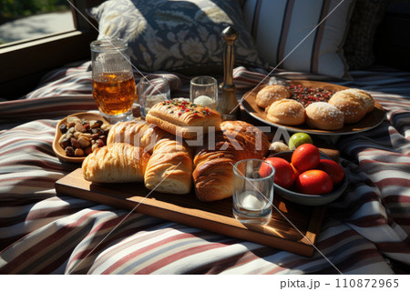 Romantic summer picnic. Snack platter on linen picnic blanket Romantic summer picnic. Snack platter on linen picnic blanket 110872965