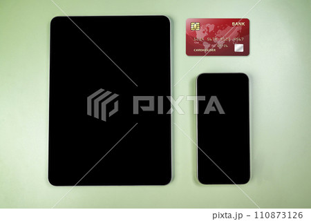 Credit cards and tablets with mobile phones with empty screens for mobile payment, banking, or online shopping 110873126