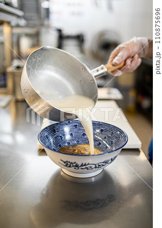 Chef making japanese ramen noodle soup Chef making japanese ramen noodle soup 110875696