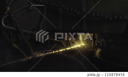 Welder complete with personal protective equipment is perform pipe welding in dark area using Automatic Welding System. Welding sparks spreading everywhere. Automat welding pipe production Welder complete with personal protective equipment is perform pipe welding in dark area using Automatic Welding System. Welding sparks spreading everywhere. Automat welding pipe production 110878456