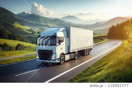 White truck driving on the highway winding through forested landscape at sunrise White truck driving on the highway winding through forested landscape at sunrise 110881777