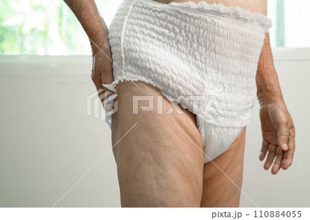 Asian senior woman patient wearing incontinence diaper in hospital, healthy strong medical concept. Asian senior woman patient wearing incontinence diaper in hospital, healthy strong medical concept. 110884055