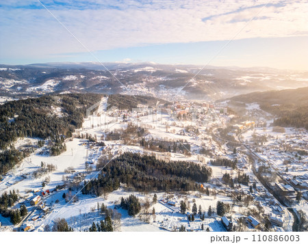 Tanvald in wintertime. Small town in Jizera Mountains, Czechia. Aerial photography from above. Tanvald in wintertime. Small town in Jizera Mountains, Czechia. Aerial photography from above. 110886003