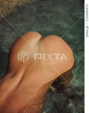 Sexy body of woman posing in sea. Attractive model with slim body 110886953