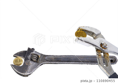 Allegory of the global financial crisis - Iron 10 rubles coin (written ten rubles, the Bank of Russia) in the grip of economic crisis, on a white background. Finance and business concept 110890455