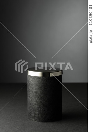 Black podium on a black background. 110890481