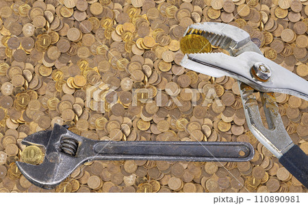 Allegory of the global financial crisis - Iron 10 rubles coin (written ten rubles, the Bank of Russia) in the grip of economic crisis. Finance and business concept 110890981