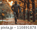 athlete with futuristic prosthetic legs jogging in the park 110891878
