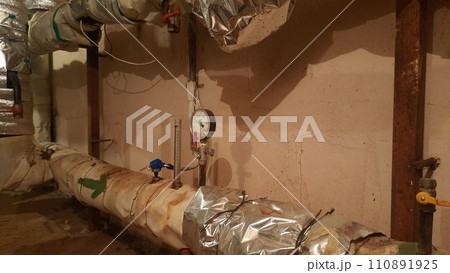 A heating unit from the inside in the basement of an apartment building 110891925