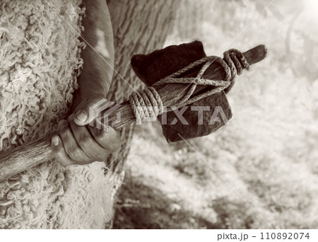 Stone ax of a primitive man 110892074