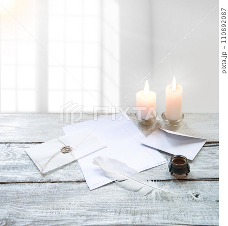 Envelope and paper with pen on the table Envelope and paper with pen on the table 110892087