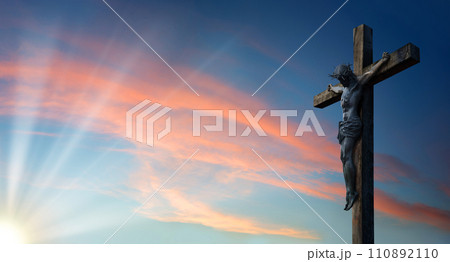 Crucified Christ hangs on the cross 110892110