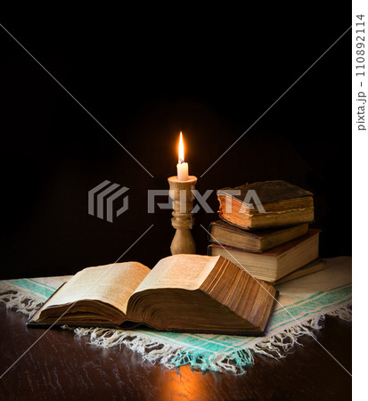 Still life from ancient books with candle 110892114