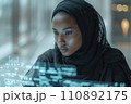 young black woman working with futuristic transparent interface 110892175